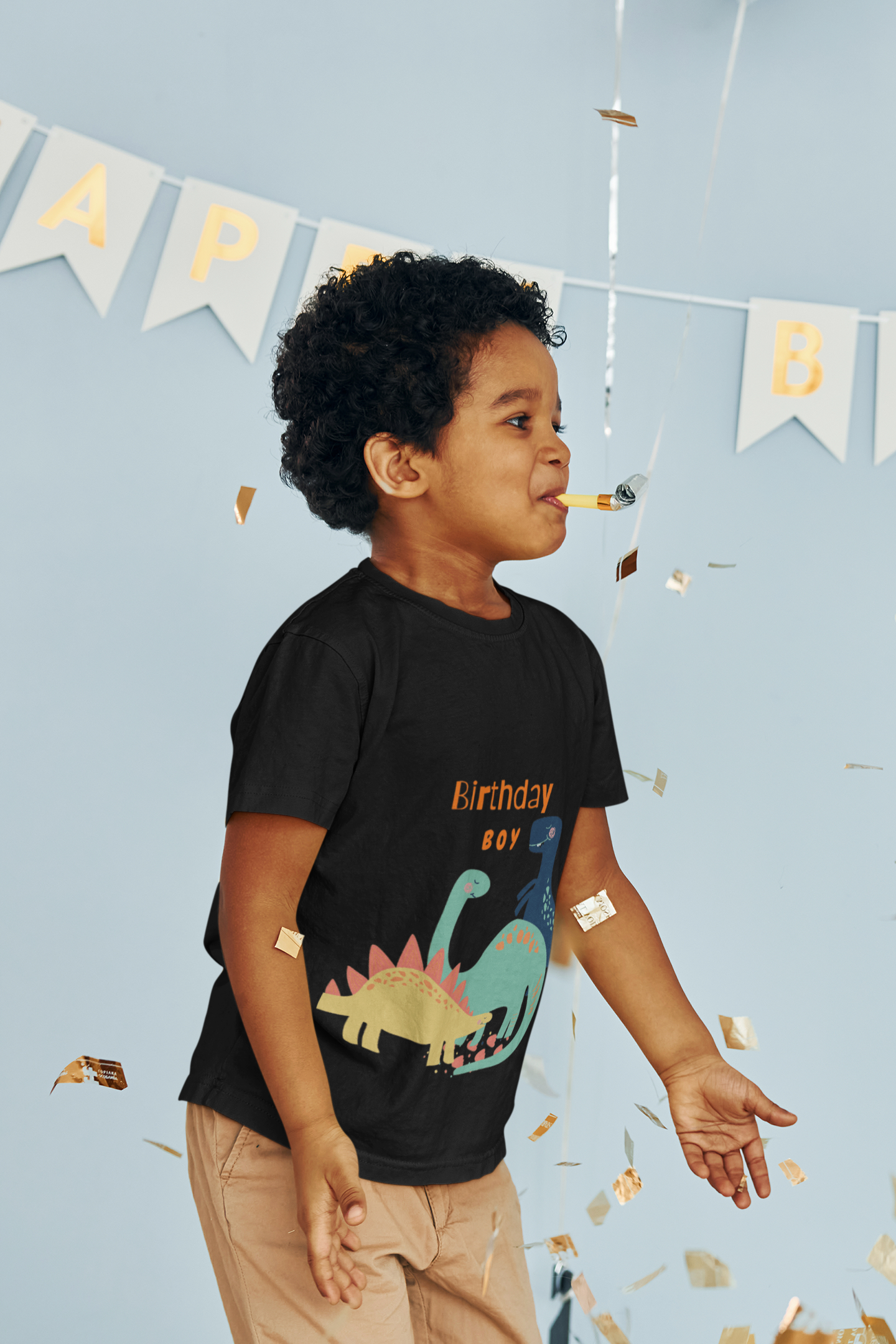 Short sleeve t-shirt with dinosaurs to celebrate a child's birthday.