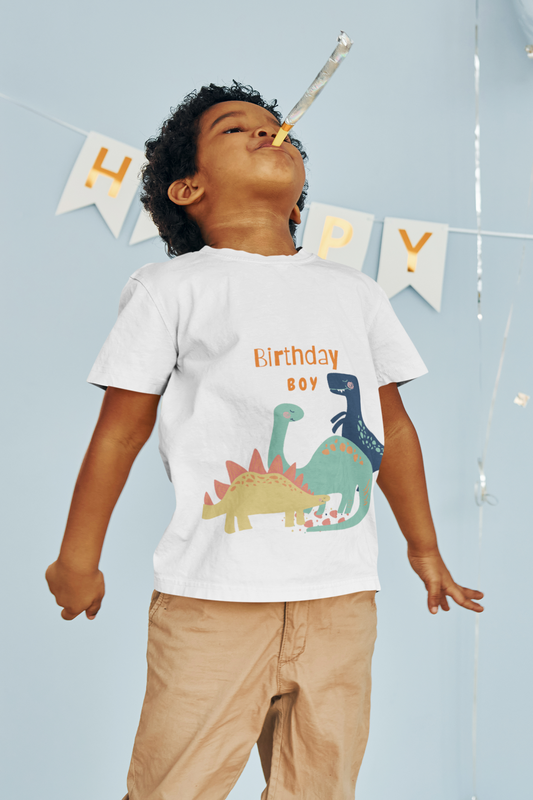 Short sleeve t-shirt with dinosaurs to celebrate a child's birthday.